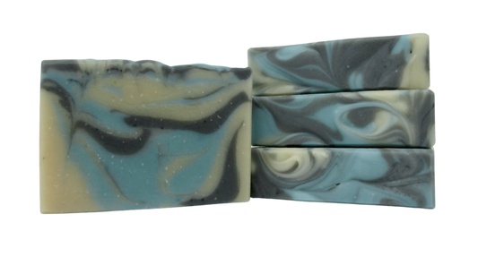 Captain's Catch Bar Soap. Goat milk soap. Spicy and smokey with notes of orange blossom, myth, bergamot oil, and sandalwood.